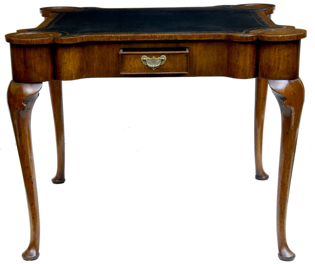 Queen anne style walnut games table on cabriole legs at 
